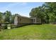 Back yard featuring a sloped lawn and well maintained lawn and landscape at 2795 Bentwood Dr, Marietta, GA 30062