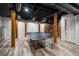Basement featuring wooden support beams, light wood flooring, and exposed duct work in the ceiling at 2795 Bentwood Dr, Marietta, GA 30062