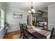 Formal dining room featuring hardwood floors and views into the living spaces at 2795 Bentwood Dr, Marietta, GA 30062