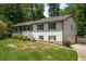 Split-level home with attached garage, landscaped front yard, and inviting entrance at 2795 Bentwood Dr, Marietta, GA 30062