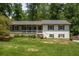 Charming split-level home featuring a landscaped front yard and a cozy front porch at 2795 Bentwood Dr, Marietta, GA 30062