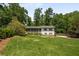 Well-manicured front lawn with a house featuring a front porch and beautiful landscaping at 2795 Bentwood Dr, Marietta, GA 30062