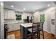 Modern kitchen with white cabinets, quartz countertops, and a center island with seating at 2795 Bentwood Dr, Marietta, GA 30062