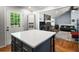 Kitchen island with ample counter space adjacent to a living area with fireplace at 2795 Bentwood Dr, Marietta, GA 30062