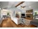 Spacious living room featuring hardwood floors, a stone fireplace, and vaulted ceilings at 2795 Bentwood Dr, Marietta, GA 30062