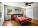 Bedroom with hardwood floors, ceiling fan, and picture windows at 2795 Bentwood Dr, Marietta, GA 30062