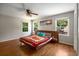 Bedroom features hardwood floors, picture windows, and ceiling fan at 2795 Bentwood Dr, Marietta, GA 30062