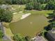 Overhead shot of a neighborhood pond and golf course at 5706 Brookstone Nw Walk, Acworth, GA 30101