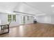 Open basement featuring durable floors, bar area, and doors to the outside at 5706 Brookstone Nw Walk, Acworth, GA 30101