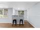 Basement bar area features modern black stools and custom light fixtures at 5706 Brookstone Nw Walk, Acworth, GA 30101