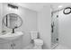Bathroom with modern sink, toilet, and glass walk-in shower with black accents at 5706 Brookstone Nw Walk, Acworth, GA 30101