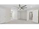 Spacious bedroom with plush carpeting, large ceiling fan, and two entry doors at 5706 Brookstone Nw Walk, Acworth, GA 30101