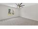 Bedroom featuring plush carpeting, large window, and modern ceiling fan at 5706 Brookstone Nw Walk, Acworth, GA 30101