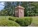 Brick community entrance with manicured hedges adds a welcoming touch and enhances curb appeal at 5706 Brookstone Nw Walk, Acworth, GA 30101