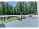 The back deck is perfect for entertaining with wooded views and outdoor seating at 5706 Brookstone Nw Walk, Acworth, GA 30101