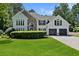 Beautiful home with a stone accent, two-car garage, well-manicured lawn, and tasteful landscaping at 5706 Brookstone Nw Walk, Acworth, GA 30101
