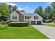 Beautiful home with a stone accent, two-car garage, well-manicured lawn, and tasteful landscaping at 5706 Brookstone Nw Walk, Acworth, GA 30101