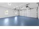 Spacious two car garage with epoxy floor, new doors, windows, and lighting at 5706 Brookstone Nw Walk, Acworth, GA 30101