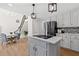Open-concept kitchen with island, stainless steel appliances, and adjoining dining area at 5706 Brookstone Nw Walk, Acworth, GA 30101