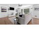 Bright living room features bay window, fireplace, hardwood floors, modern décor, and neutral color palette at 5706 Brookstone Nw Walk, Acworth, GA 30101