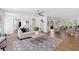 Elegant living room with hardwood floors, modern décor, a neutral color palette, and plenty of seating at 5706 Brookstone Nw Walk, Acworth, GA 30101