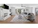Cozy living room features a fireplace, bay windows, hardwood floors, and contemporary décor at 5706 Brookstone Nw Walk, Acworth, GA 30101
