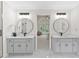 Elegant bathroom featuring dual vanities, modern fixtures, and an open doorway leading to the main bedroom at 5706 Brookstone Nw Walk, Acworth, GA 30101