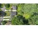 Aerial view of the property showing the roof, driveway, lush backyard with mature trees at 805 Gertrude Nw Pl, Atlanta, GA 30318