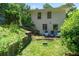 Backyard featuring a well-maintained lawn and outdoor seating area at 805 Gertrude Nw Pl, Atlanta, GA 30318