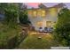 Charming backyard featuring a patio area with outdoor seating surrounded by lush greenery and the home's exterior at 805 Gertrude Nw Pl, Atlanta, GA 30318