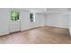 Finished basement featuring new floors, a door to the exterior, and updated lighting at 805 Gertrude Nw Pl, Atlanta, GA 30318