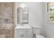 Stylish bathroom featuring a tiled shower, modern vanity, and views of the bedroom at 805 Gertrude Nw Pl, Atlanta, GA 30318
