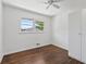 Bright bedroom featuring hardwood floors, a closet, and natural light at 805 Gertrude Nw Pl, Atlanta, GA 30318