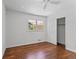 Comfortable bedroom features hardwood floors and a closet for ample storage at 805 Gertrude Nw Pl, Atlanta, GA 30318