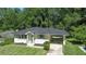 Charming single-story home with a well-manicured lawn and attached carport at 805 Gertrude Nw Pl, Atlanta, GA 30318