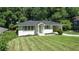 Charming single-story home with a well-manicured lawn and attached carport at 805 Gertrude Nw Pl, Atlanta, GA 30318