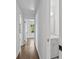 Hallway with hardwood floors and a view into bathroom at 805 Gertrude Nw Pl, Atlanta, GA 30318