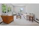 Bright living room with white furniture, a patterned coffee table, and large windows at 805 Gertrude Nw Pl, Atlanta, GA 30318