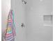 Modern shower featuring white subway tile and recessed shelf, great for bathroom amenities at 805 Gertrude Nw Pl, Atlanta, GA 30318