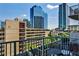 Charming balcony with seating area and views of the city skyline at 860 Peachtree Street Northeast Ne St # 811, Atlanta, GA 30308