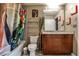 Well-appointed bathroom with wood vanity, decorative shower curtain, and modern fixtures at 860 Peachtree Street Northeast Ne St # 811, Atlanta, GA 30308