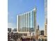 Stunning high-rise building with many windows and balconies against a clear blue sky at 860 Peachtree Street Northeast Ne St # 811, Atlanta, GA 30308