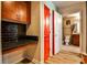 Hallway area features wood-look floors, built-in desk and bright red door at 860 Peachtree Street Northeast Ne St # 811, Atlanta, GA 30308