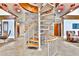Stylish spiral staircase with stone wall accent and wood treads at 860 Peachtree Street Northeast Ne St # 811, Atlanta, GA 30308