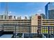 Balcony view showcasing the city skyline, and modern buildings with clear blue skies at 860 Peachtree Street Northeast Ne St # 811, Atlanta, GA 30308