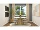 Stylish dining room with a round table, four chairs, contemporary art, and a large window at 2276 Linden Pass, Douglasville, GA 30135
