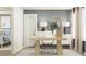 Home office space with computer, large windows, and bedroom in the background at 2276 Linden Pass, Douglasville, GA 30135
