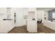 Contemporary kitchen with sleek white cabinets, stainless steel appliances, and a functional island at 2276 Linden Pass, Douglasville, GA 30135