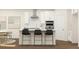 Modern kitchen featuring an island with bar stools and stainless steel appliances at 2276 Linden Pass, Douglasville, GA 30135