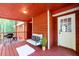 Relaxing back porch with room to grill and a comfortable seating area to relax in the fresh air at 4771 N Springs Nw Rd, Kennesaw, GA 30144